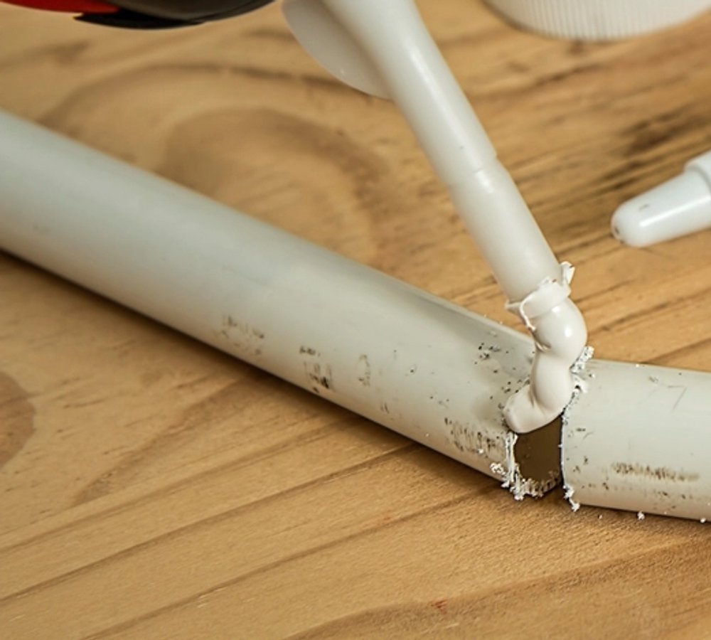 Adhesives & Sealants — applying sealant to a pipe joint